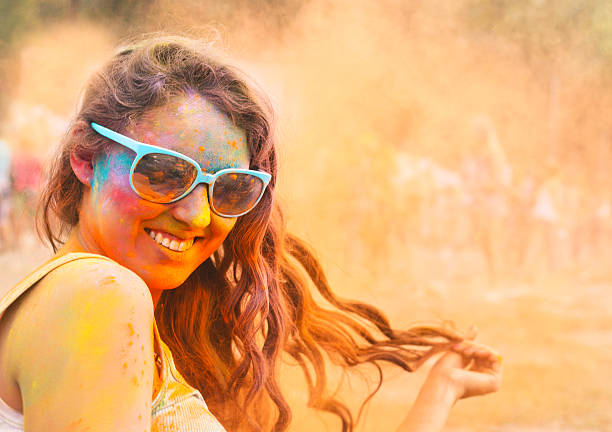 Happy young girl on holi color festival Portrait of happy young girl on holi color festival holi photos stock pictures, royalty-free photos & images