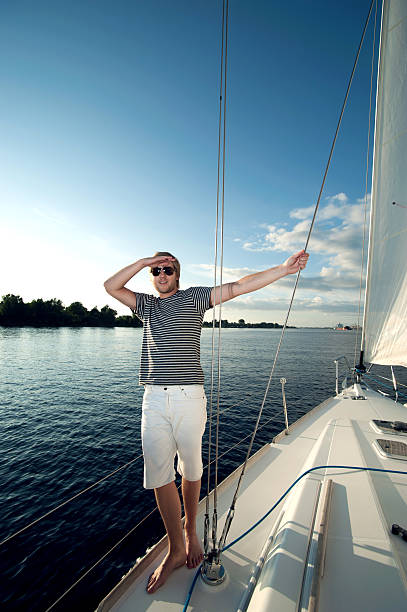 Happy young man on a yacht