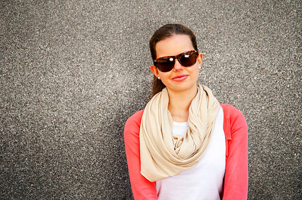 Happy young woman smiling with copy space with sunglasses. stock photo