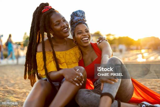 Happy young women enjoying the outdoors at sunset