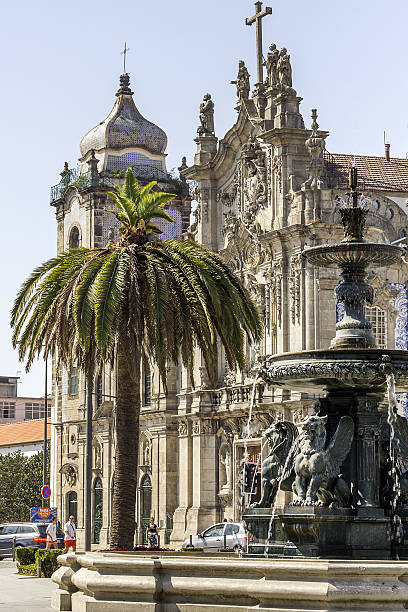 harbor Porto, Portugal - September 3, 2016: Fountain in front of Igreja dos Carmelitas in Porto. The church of the Carmelite Order, completed in 1750, almost ends with its interior decoration in the rococo style. thomas wells stock pictures, royalty-free photos & images