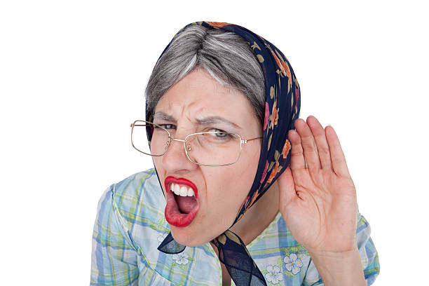 Hard of Hearing Old Woman A fisheye image of a crabby old woman who can't hear. ugly old women stock pictures, royalty-free photos & images