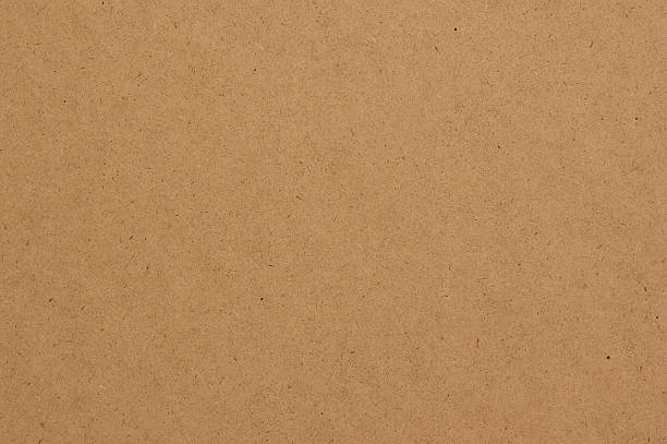 Hardboard texture with tan colors high-density fiberboard texture up-close. cardboard stock pictures, royalty-free photos & images
