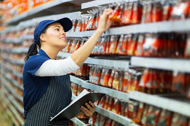 hardware store worker counting stock stock photo