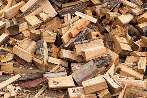 Hardwood pile ready to be used as firewood. High quality photo