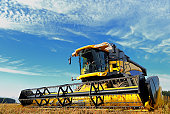 istock harvesting combine in the field 118422895