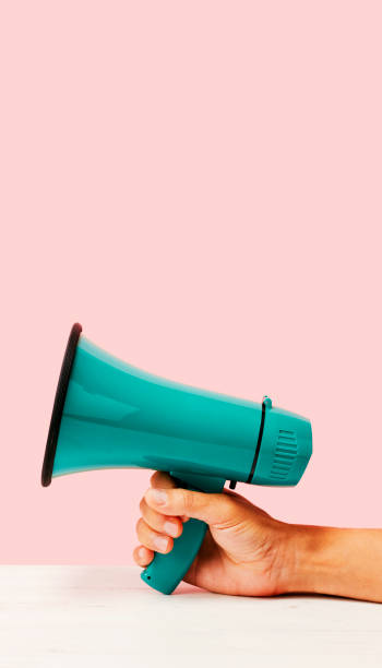 has a megaphone, in mobile stories format stock photo