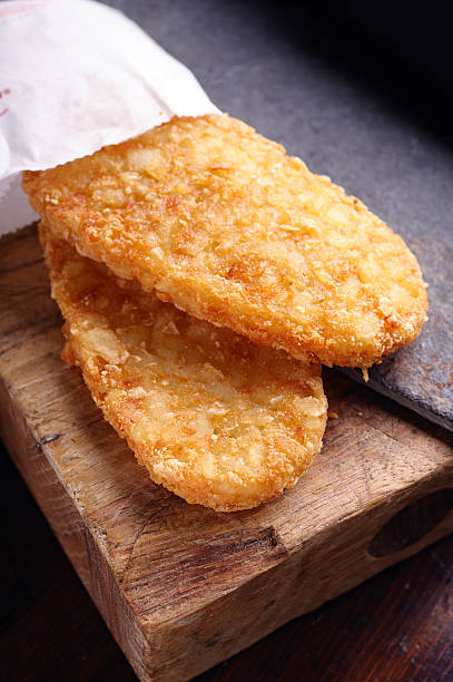 Hash Brown Hash Browns on Cutting Board hash brown photos stock pictures, royalty-free photos & images