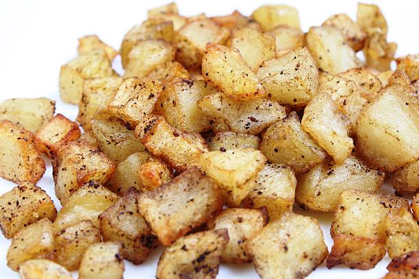 Hash Browns Hash browns against a white background. hash brown stock pictures, royalty-free photos & images