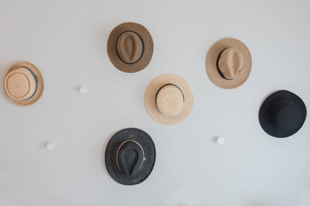 hats hanging on wall stock photo