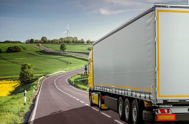 Haulage - Trucking Delivery - Truck Transport. Tractor unit pulling a semi-trailer through a beautiful landscape. luxembourg benelux stock pictures, royalty-free photos & images
