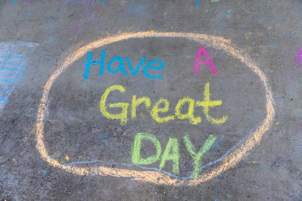 "Have a Great Day" phrase written with Sidewalk Chalk stock photo