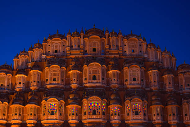 Hawa Mahal, Jaipur, Rajasthan, India Hawa Mahal the most iconic symbol at Jaipur, capital city of Rajasthan, India. Dusk time with illuminated scenic facade and blue sky. hawa mahal stock pictures, royalty-free photos & images