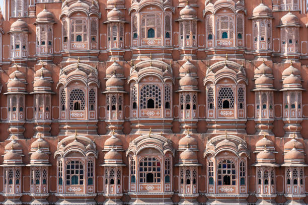 Hawa Mahal, pink palace of winds in old city Jaipur, Rajasthan, India. Background of indian architecture Hawa Mahal wall front view, pink palace of winds in old city Jaipur, Rajasthan, India. Background of indian architecture, close up hawa mahal stock pictures, royalty-free photos & images