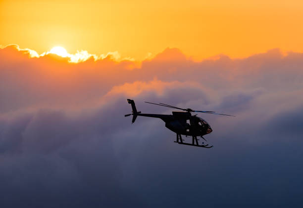 Hawaiian helicopter flying toward Killauea crater stock photo