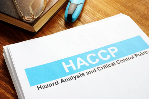 haccp hazard analysis and critical control points report on table. - haccp imagens e fotografias de stock