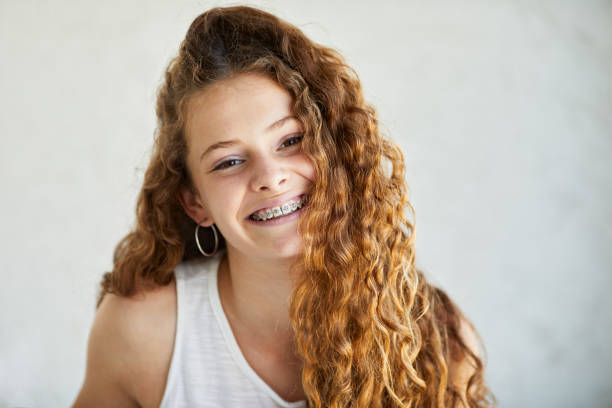 Head shot portrait of a teenage girl. Family lifestyle in Buenos Aires dental braces stock pictures, royalty-free photos & images