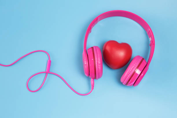 Headphones and heart concept for love listening to music stock photo