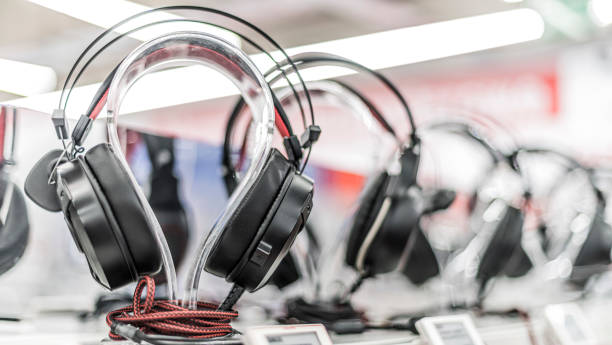 Headphones on stands put up for sale in a store stock photo