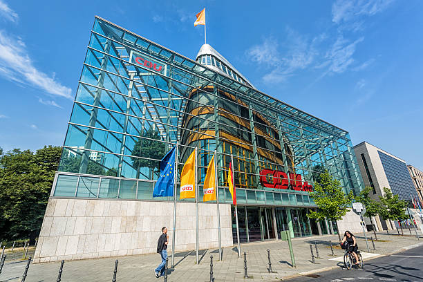 CDU headquarter in Berlin "Berlin, Germany - August 06, 2013: Front facade of the CDU headquarters in Berlin. People passing the office building. CDU is one of two great traditional parties in Germany." christian democratic union stock pictures, royalty-free photos & images