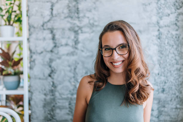 Headshot of gorgeous young woman with eyeglasses. Headshot of gorgeous young woman with eyeglasses. young women stock pictures, royalty-free photos & images