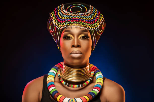 Headshot portrait of a beautiful African Queen wearing a headdress stock photo