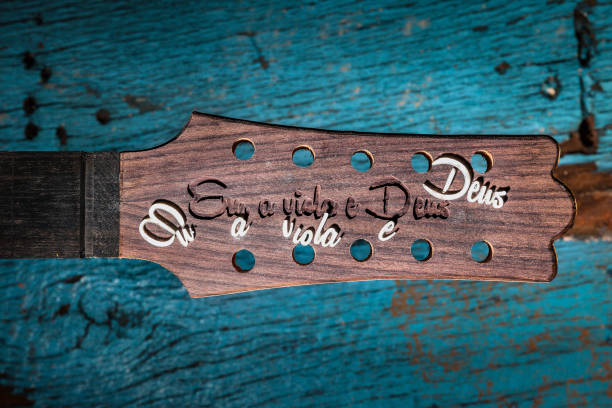 Headstock of a brazilian guitar under construction. Written in portuguese, "Me, the guitar and God" Headstock of a brazilian guitar under construction. Written in portuguese, "Me, the guitar and God" oficina stock pictures, royalty-free photos & images