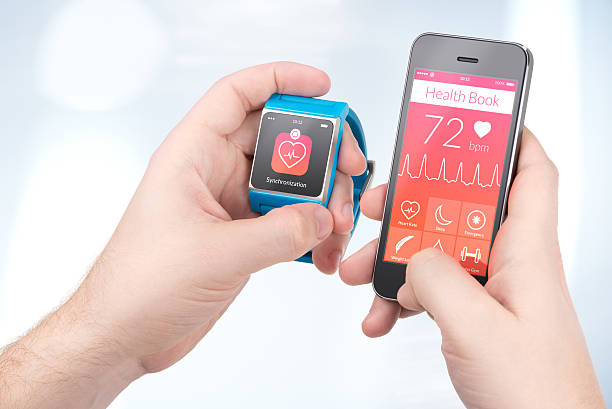 Health data synchronization between smartwatch and smartphone stock photo