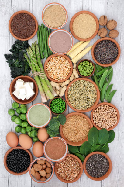 Health Food High in Protein Health food high in protein with tofu, fresh vegetables, legumes, grains, dairy, supplement powders, seeds and nuts. Super foods high in dietary fibre, vitamins and antioxidants. Top view. pea protein powder stock pictures, royalty-free photos & images