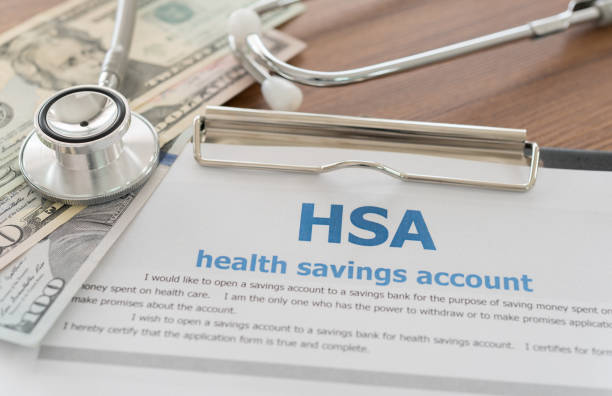 health savings account health savings account, HSA concept with application form,dollar money, stethoscope on desk. bank account stock pictures, royalty-free photos & images