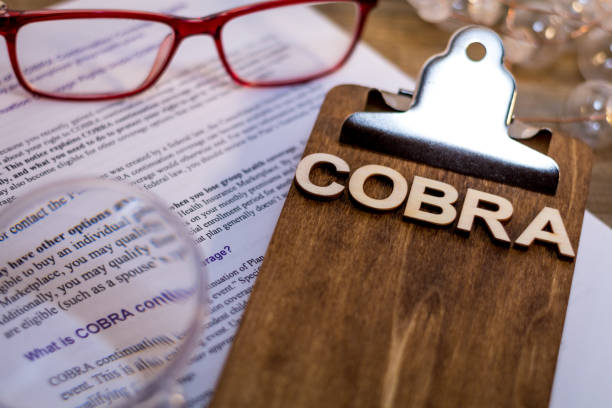 COBRA Healthcare Insurance Benefits for Unemployment concept COBRA Healthcare Insurance Benefits for Unemployment concept on wooden board cobra stock pictures, royalty-free photos & images