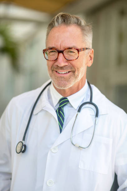 Healthcare professional smiling at work stock photo