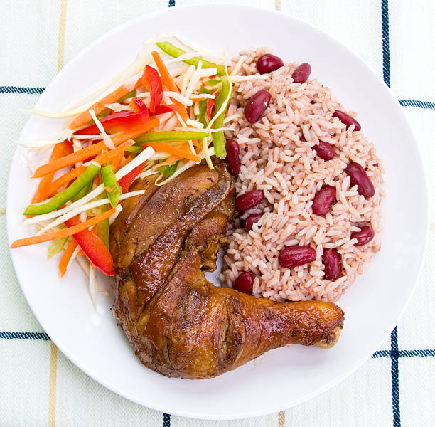 A healthy balanced meal Caribbean style with jerk chicken stock photo