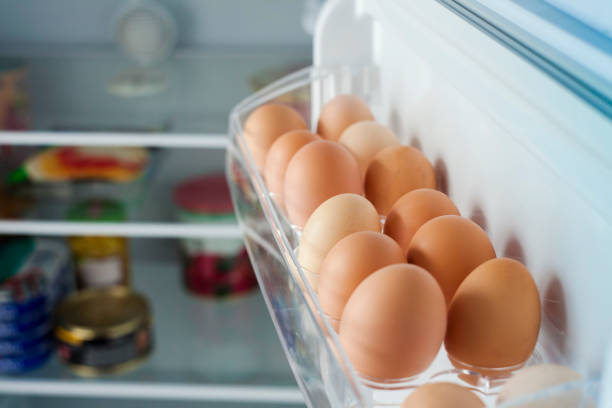 healthy bio eggs in the fridge stock photo
