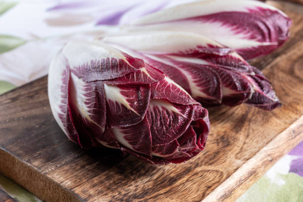Healthy food Belgian endive red chicory lof lettuce close up stock photo