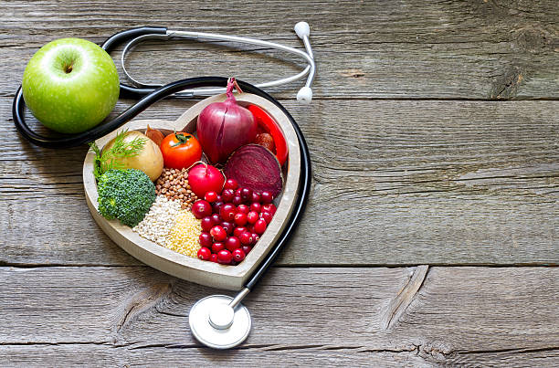healthy food in heart and cholesterol diet concept - alternatif tıp stok fotoğraflar ve resimler