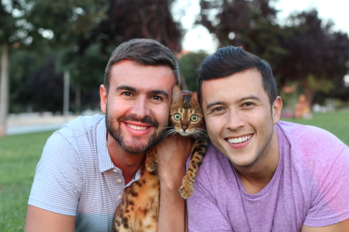 Healthy Gay Couple With A Bengal Cat Stock Photo - Download Image Now ...