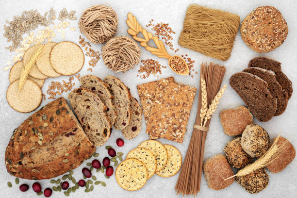 Healthy High Fibre Food Collection Healthy high fibre food with whole grain bread, crackers, pasta & seeds. High in antioxidants, omega 3, vitamins & protein with low GI levels. Helps to lower blood pressure, cholesterol and optimises a healthy heart. 7 grain bread photos stock pictures, royalty-free photos & images