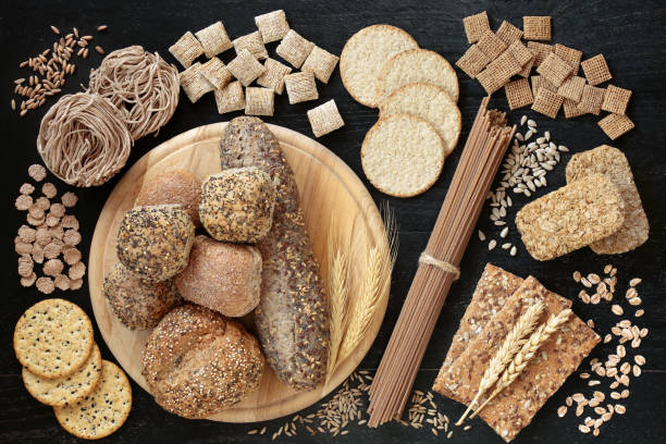 Healthy High Fibre Food for Good Health Healthy high fibre food for good health high in antioxidants, omega 3, vitamins & protein with low gi levels. Health foods to lower blood pressure & cholesterol & optimise a healthy heart. Flat lay. 7 grain bread photos stock pictures, royalty-free photos & images