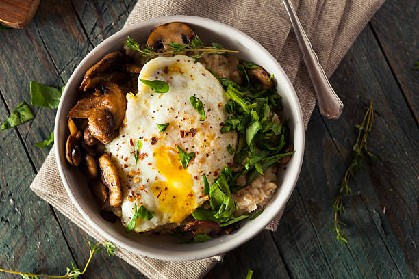 healthy homemade savory oatmeal - hartig voedsel stockfoto's en -beelden