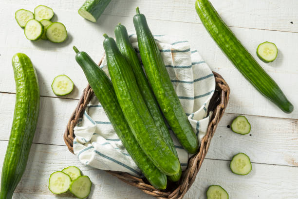 Healthy Organic Green English Cucumbers Healthy Organic Green English Cucumbers Ready to Eat cucumber stock pictures, royalty-free photos & images