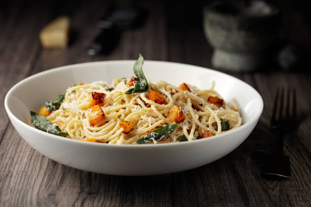 Healthy spaghetti with roasted butternut squash and sage butter stock photo
