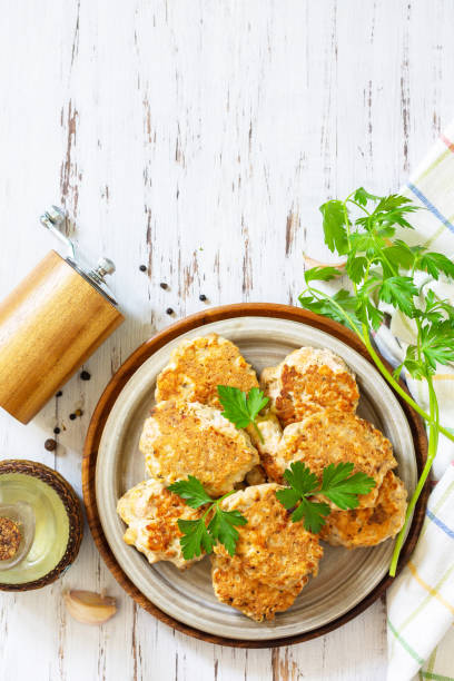 Healthy vegan food. Tasty homemade Red fish cutlets on a wooden rustic table. Top view, flat lay background. Copy space. stock photo