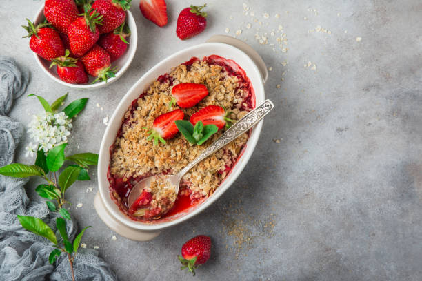 healthy vegan rhubarb and strawberry  oats crumble pie for breakfast healthy vegan rhubarb and strawberry  oats crumble pie for breakfast, top view, copy space crumble stock pictures, royalty-free photos & images
