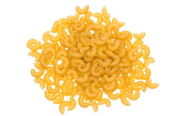 heap of italian pasta isolated on white background stock photo