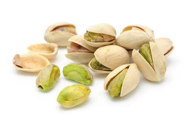 Heap of pistachios nuts  pistachio stock pictures, royalty-free photos & images