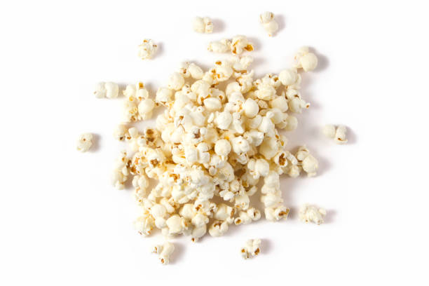 Heap of Popcorn Above view of fresh popcorn isolated on white background popcorn stock pictures, royalty-free photos & images