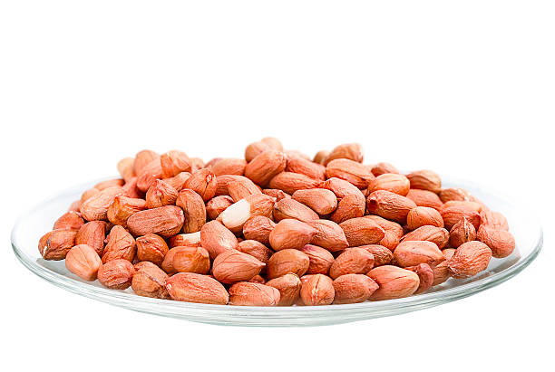 heap of raw peanuts in a saucer - pea protein powder isolated bildbanksfoton och bilder
