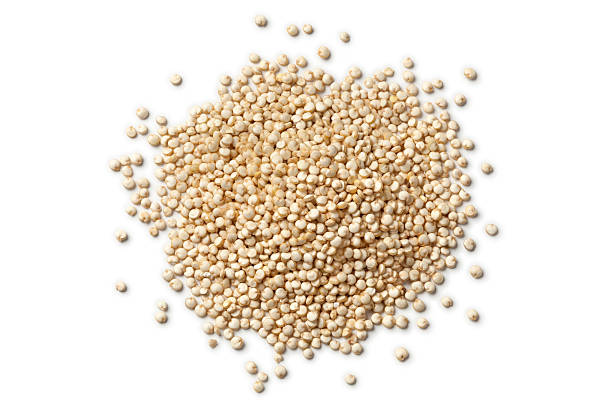 Heap of raw Quinoa seeds stock photo