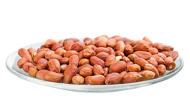 heap of roasted peanuts in a saucer - pea protein powder isolated bildbanksfoton och bilder